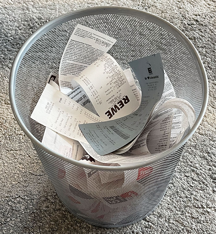 receipts in a trash can
